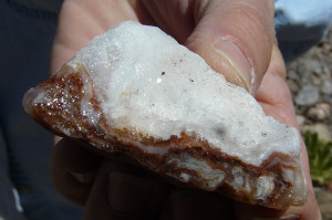 Banded agate, possibly contains layers of "fire" with drusy quartz on top.