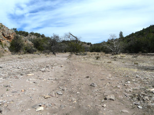 Looking east up the large intermittent stream dry wash of Little Dry Creek Canyon towards Soldier Hill in the distance, site of the ambush of Lt. Samuel Fountain and Troop C of the 34th US Calvary at Soldier Hill by the Apache Chief Ulzana and his warriors on December 19, 1885.