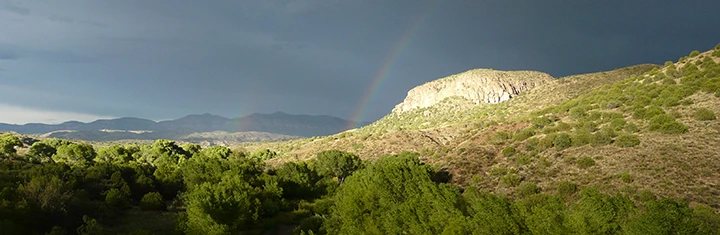 monsoon thunderstorm and rainbow.